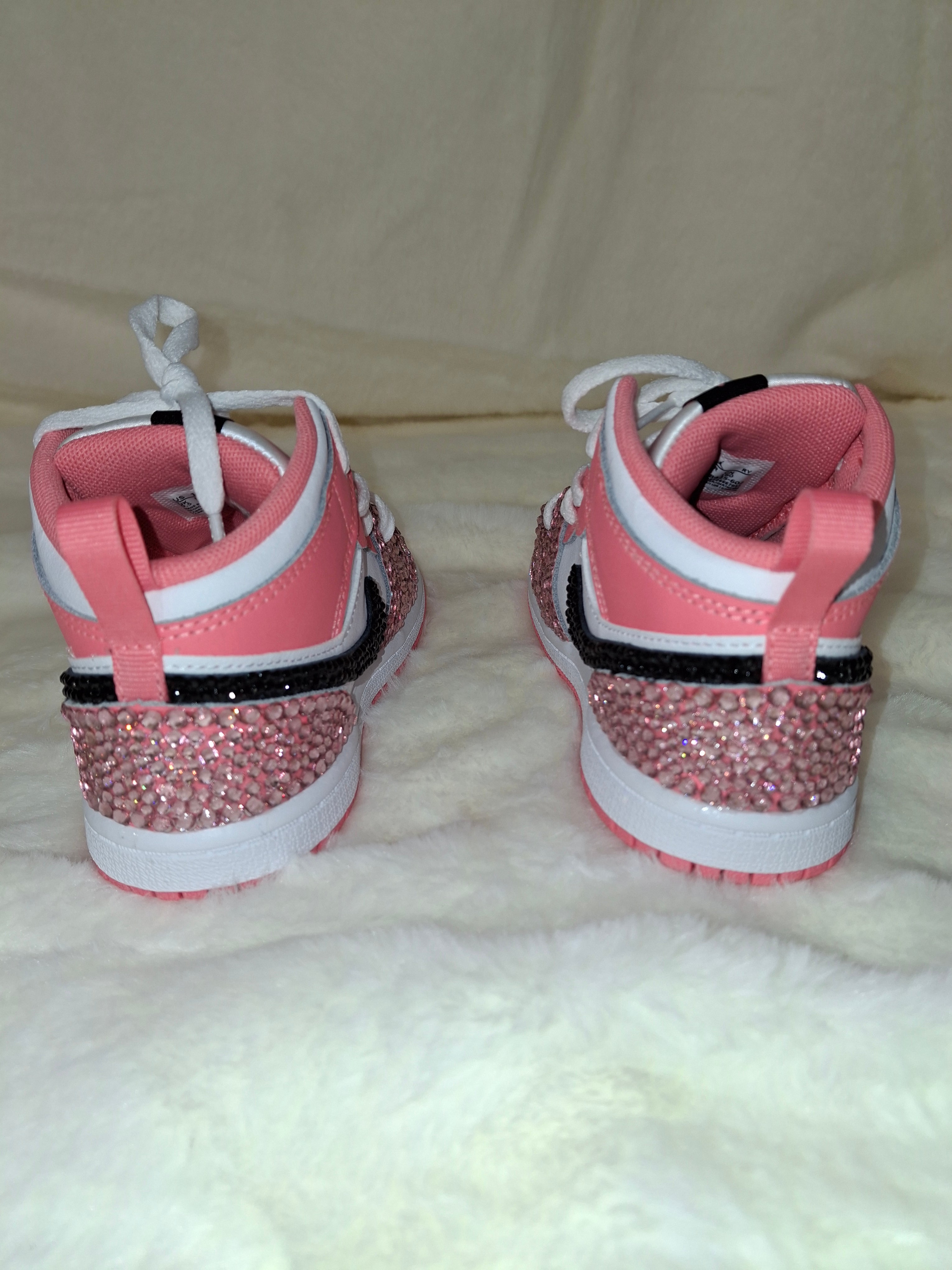 Custom pink rhinestone blinged Air Jordan Mid 1 kids sneakers by Dressed and Done