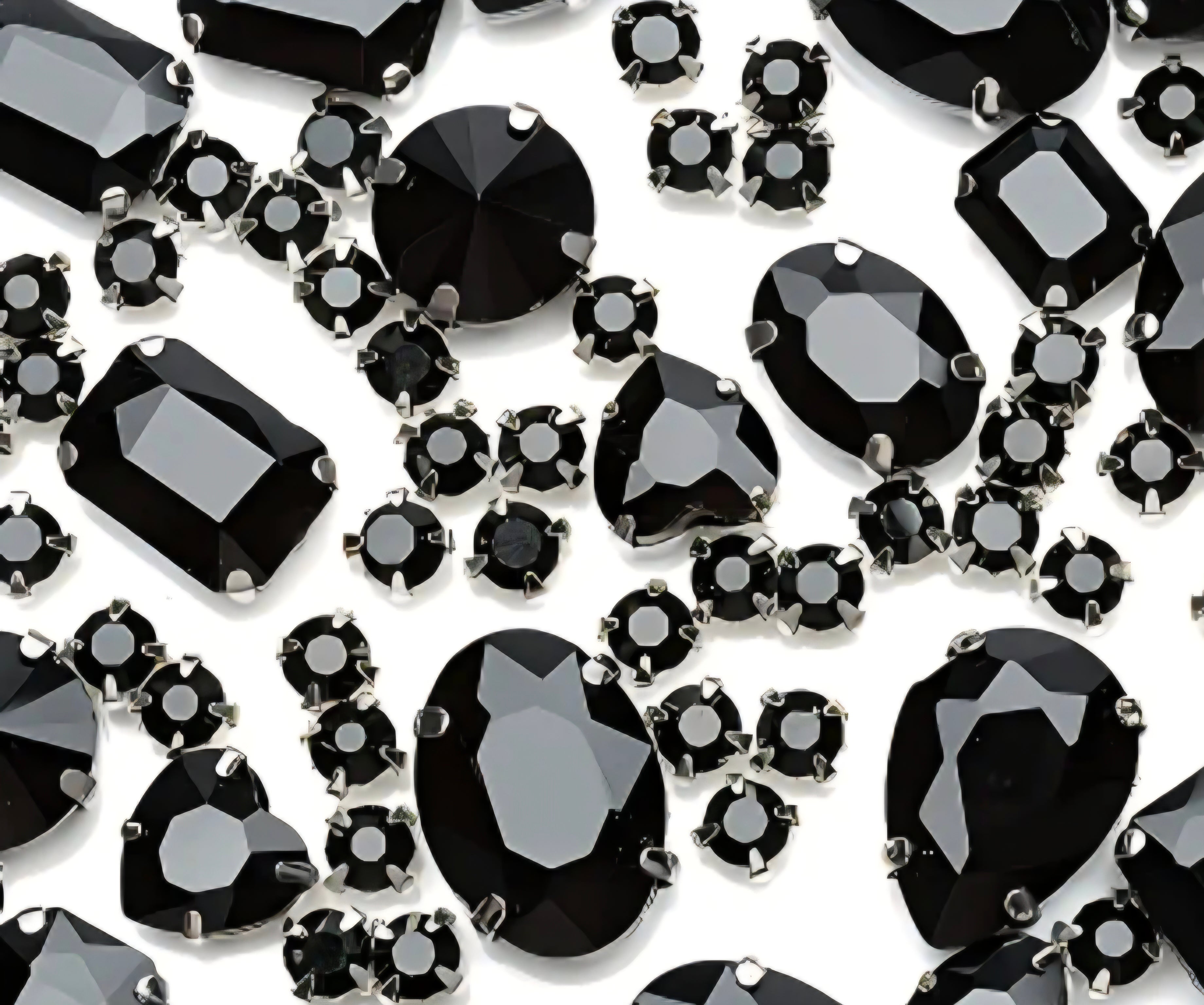 Collection of black gemstones on a white background