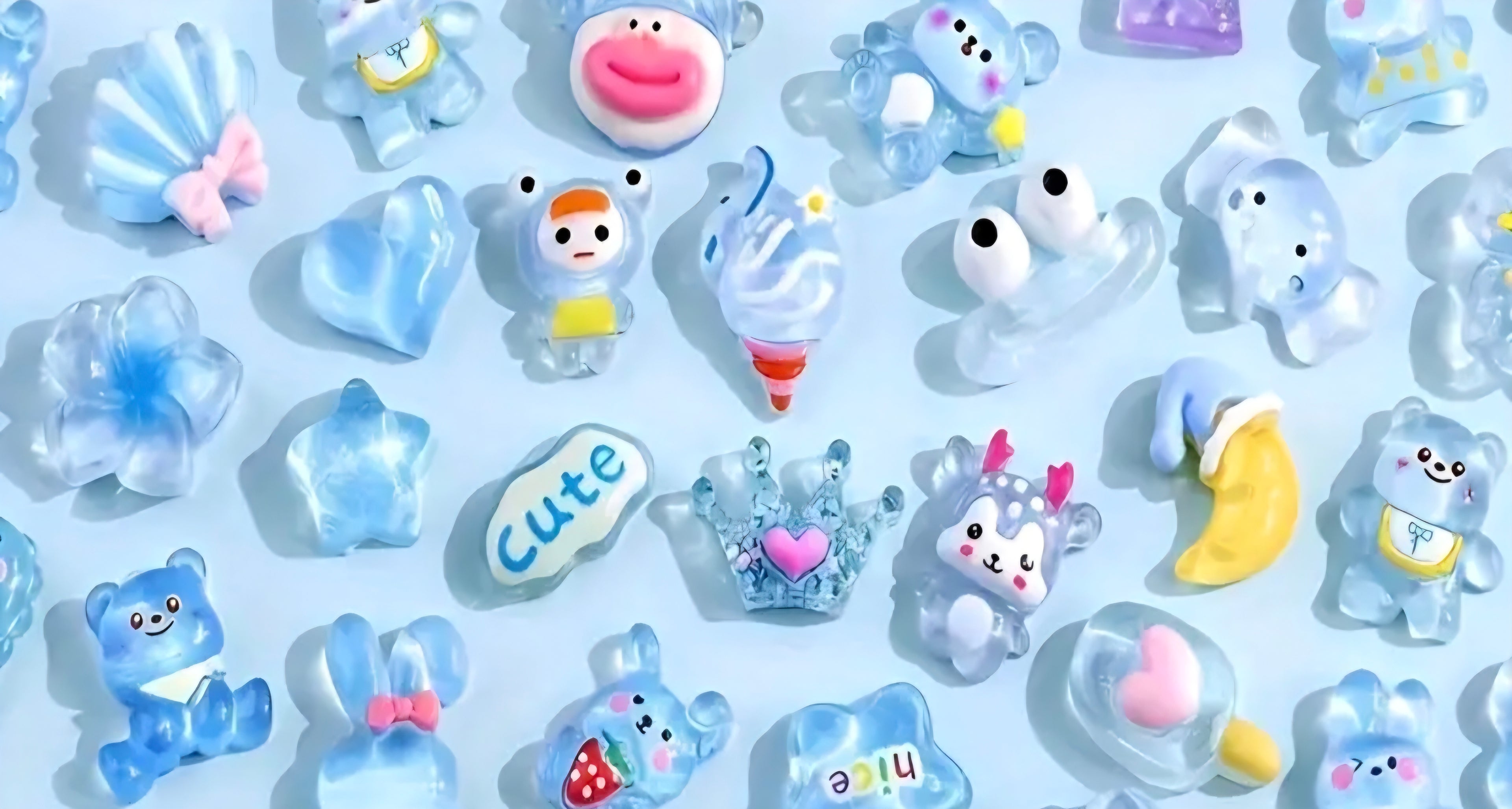 Collection of cute cartoon figurines and shapes on a light blue background