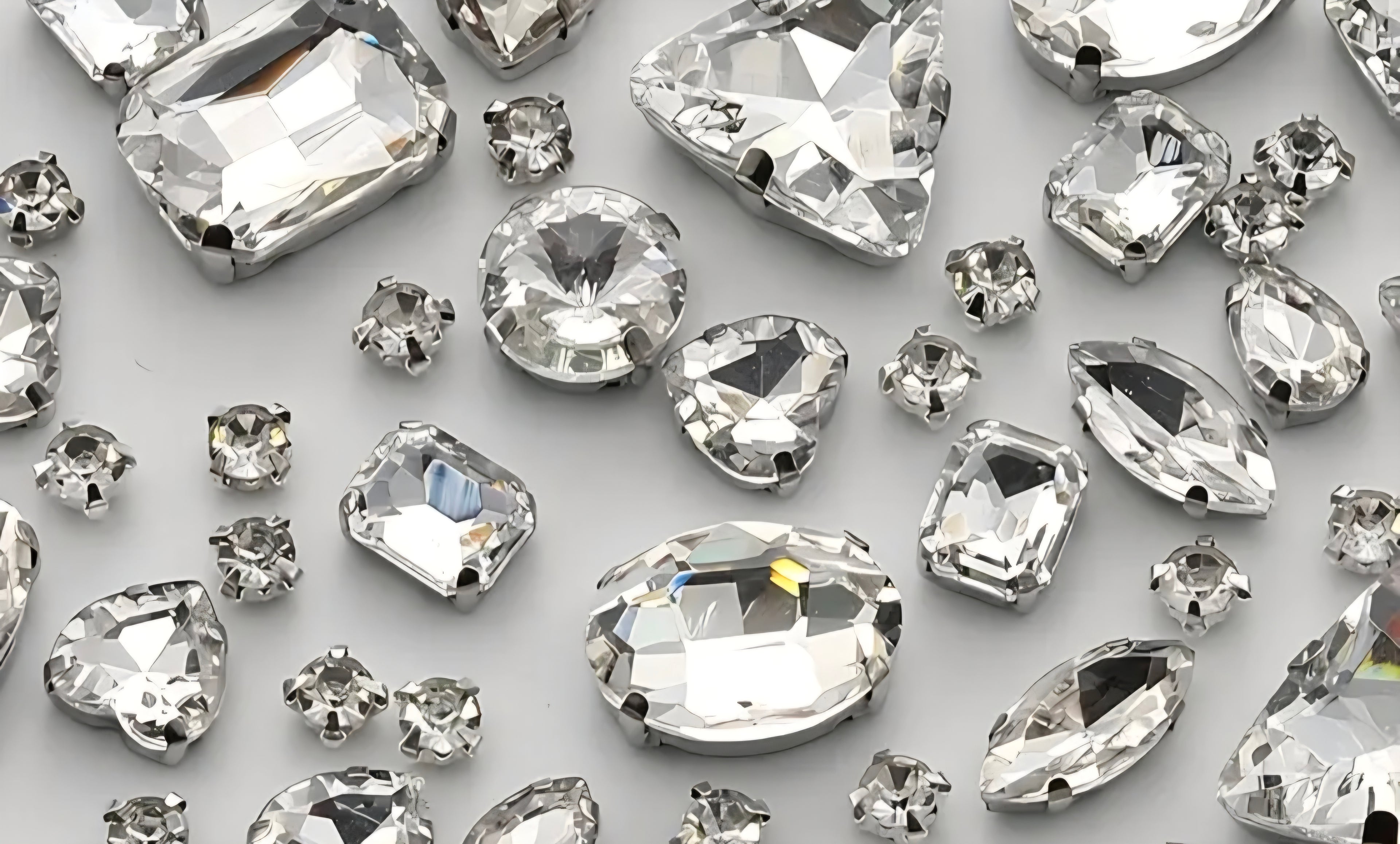 Collection of clear gemstones on a light gray background
