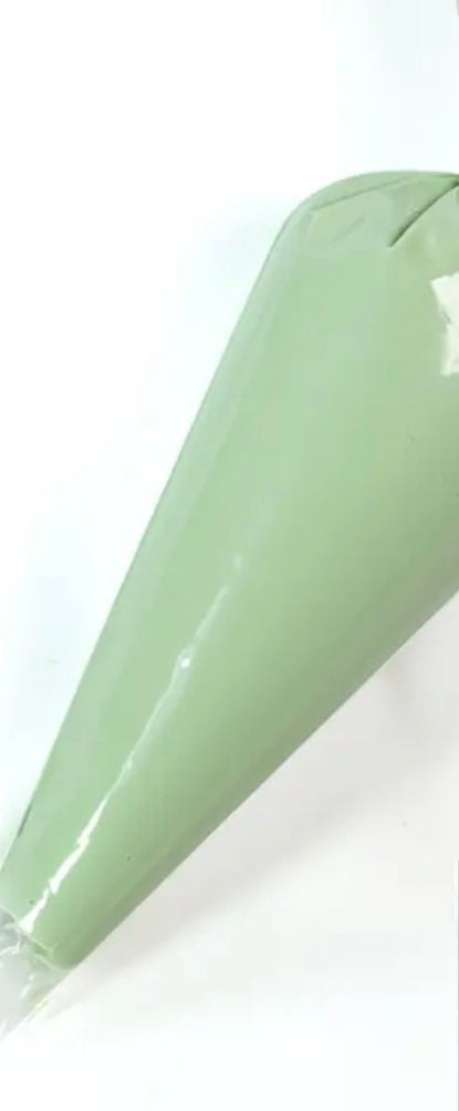 Green cream glue on a white background