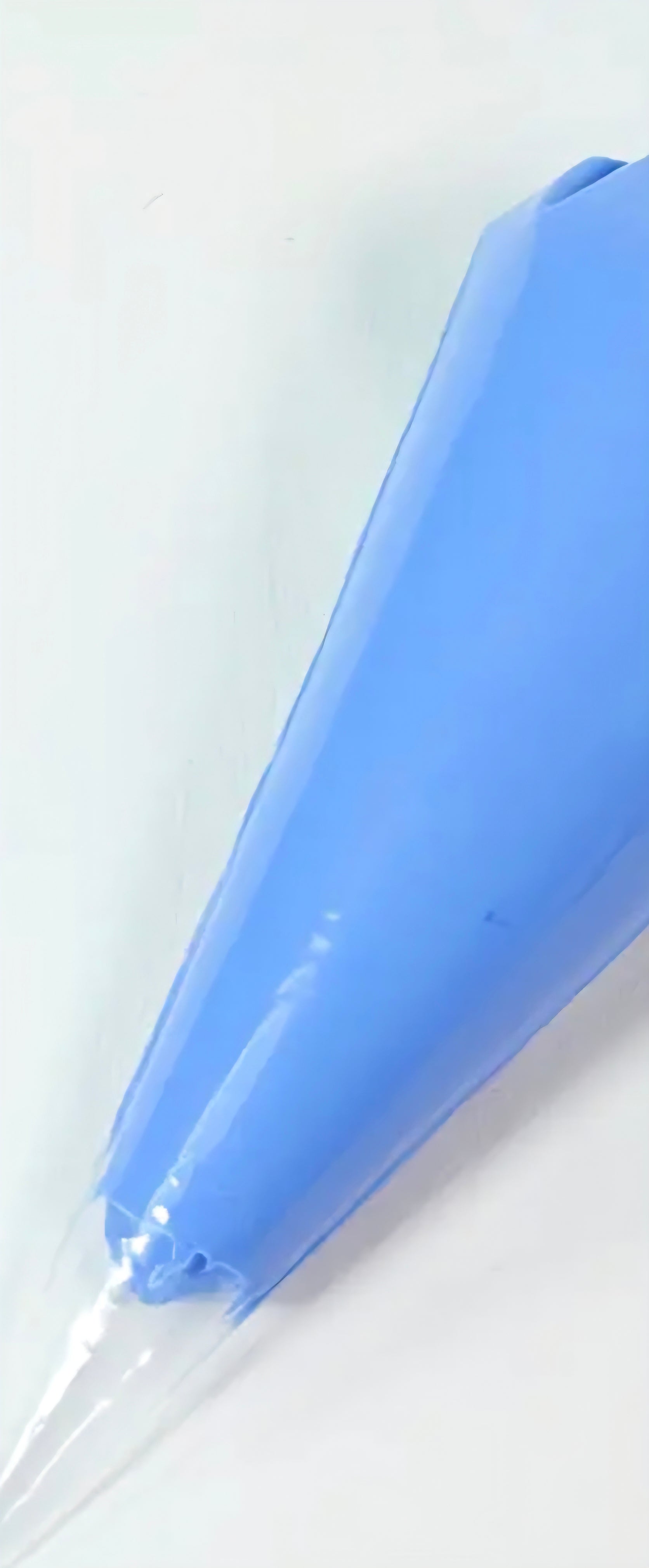 Blue cream decoden glue tube on a white background