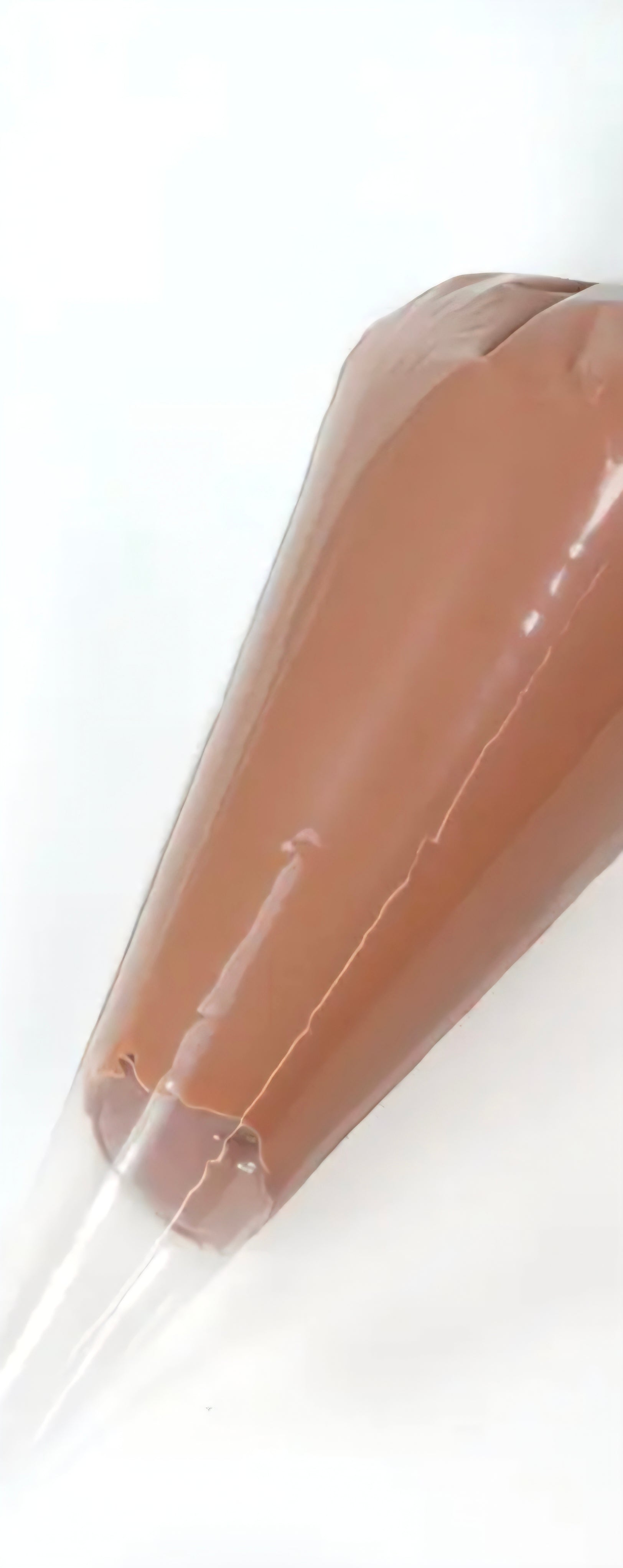 Coffee colored decoden cream glue tube on a white background