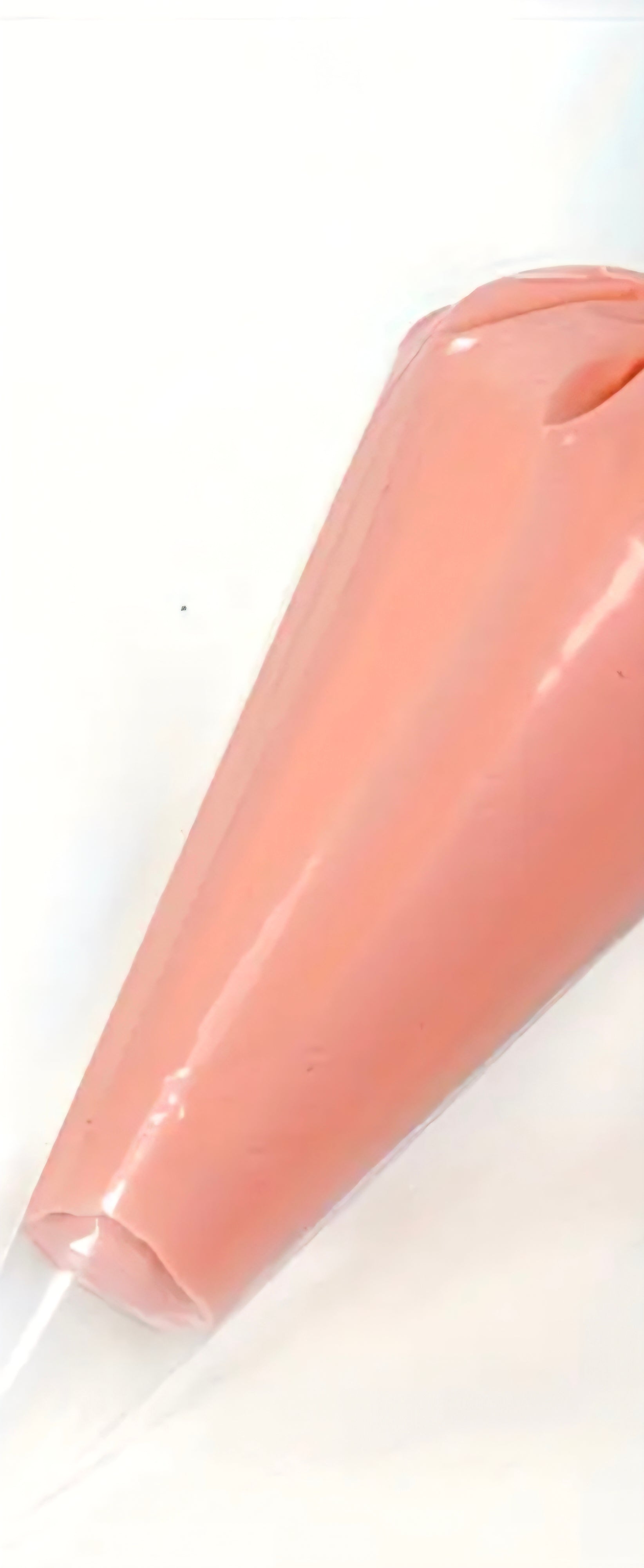 Coral cream glue tube for crafts on a white background