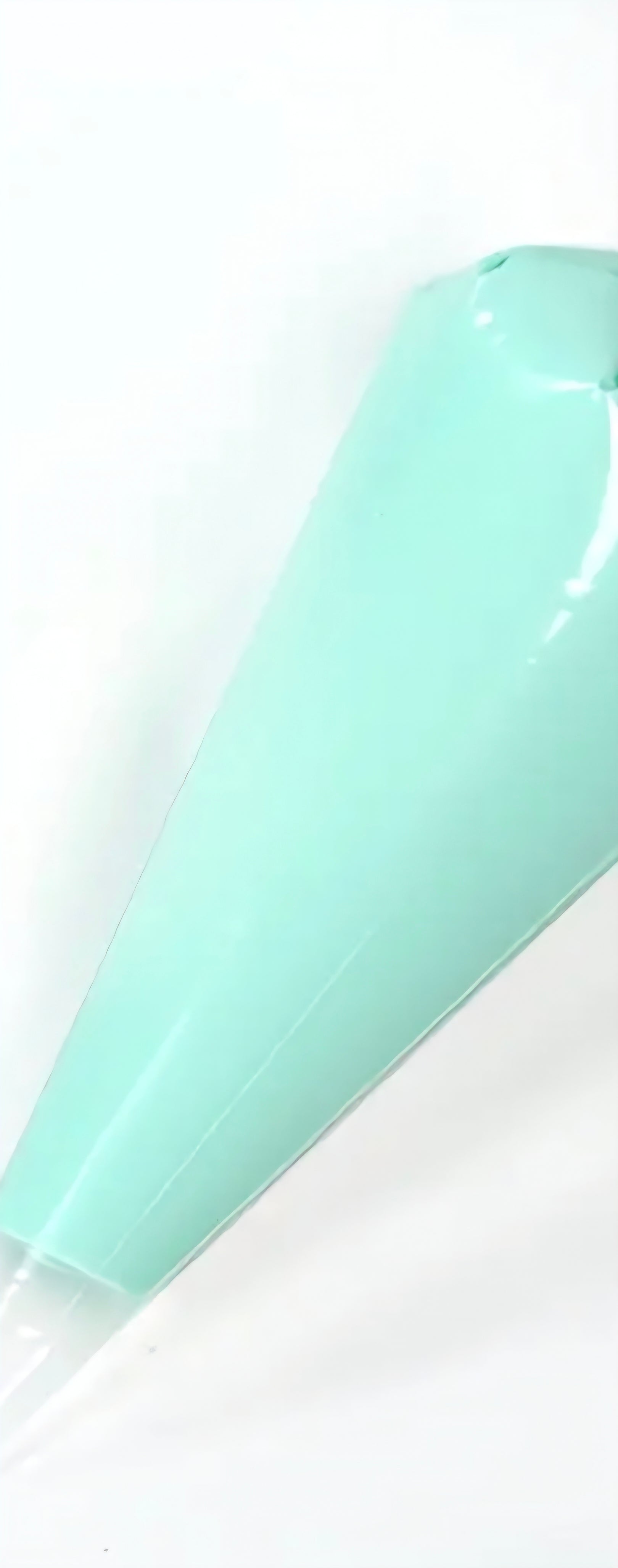 Light green decoden cream glue tube on a white background. 