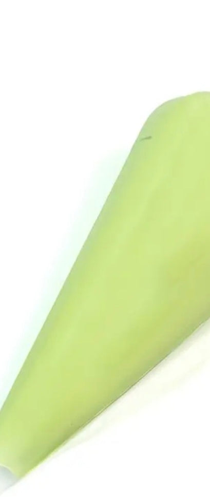 Light green decoden cream glue tube on a white background