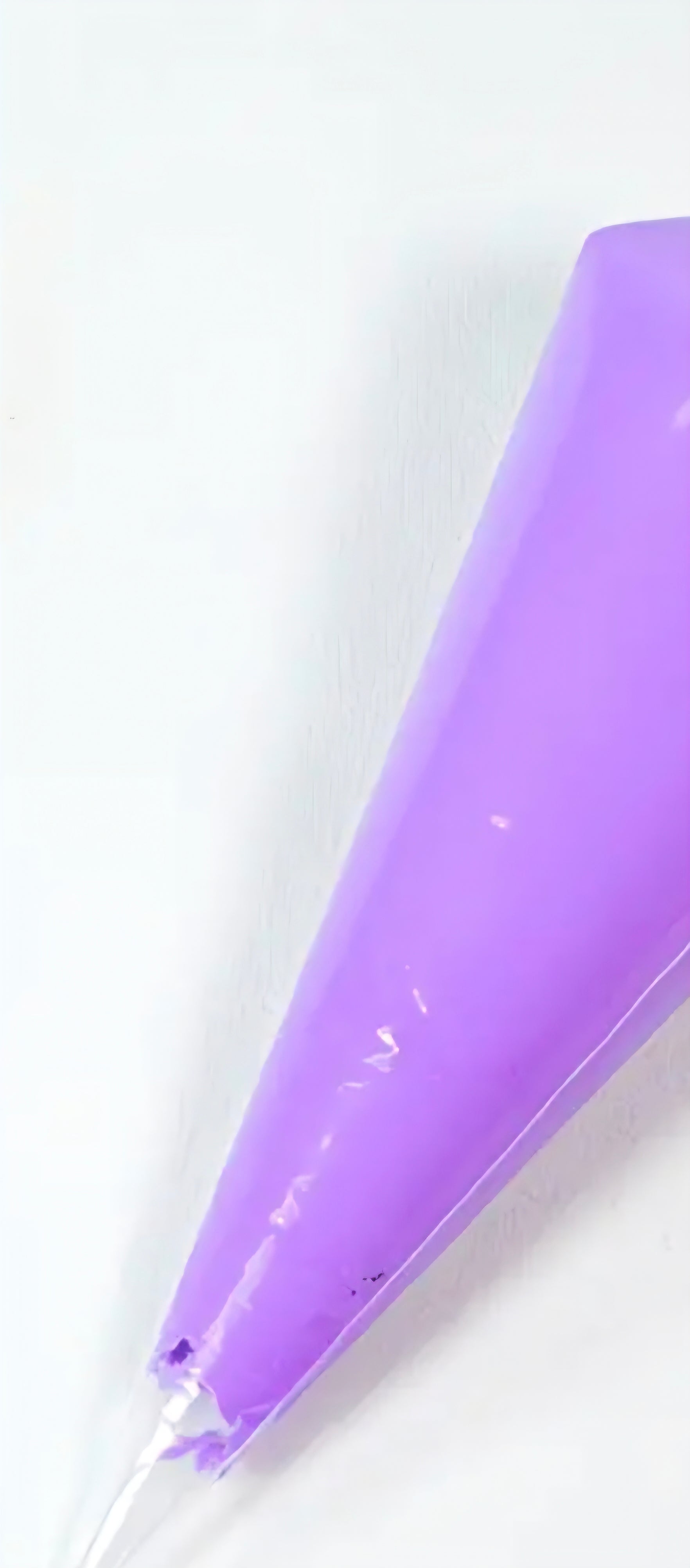 Purple decoden cream glue tube on a white background
