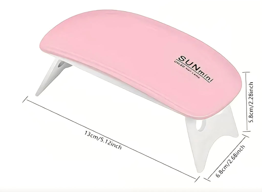 Pink nail lamp with dimensions on a white background