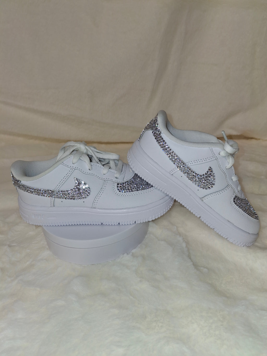 Custom blinged white Air Force 1 sneakers handcrafted by Dressed and Done