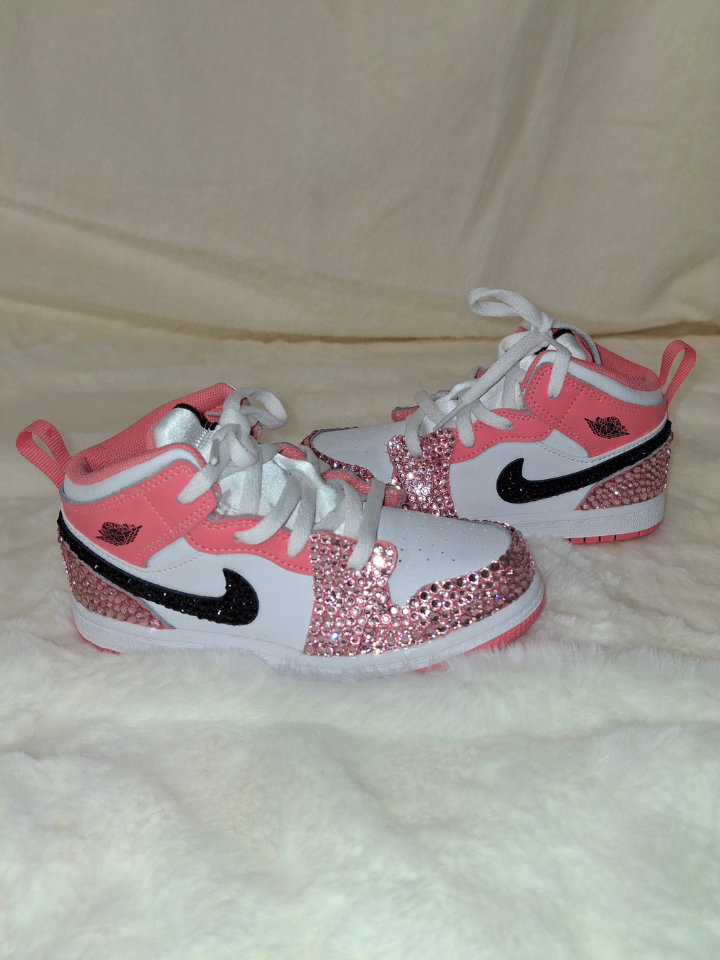 Custom pink and white rhinestone Air Jordan Mid 1 Kids sneakers by Dressed and Done