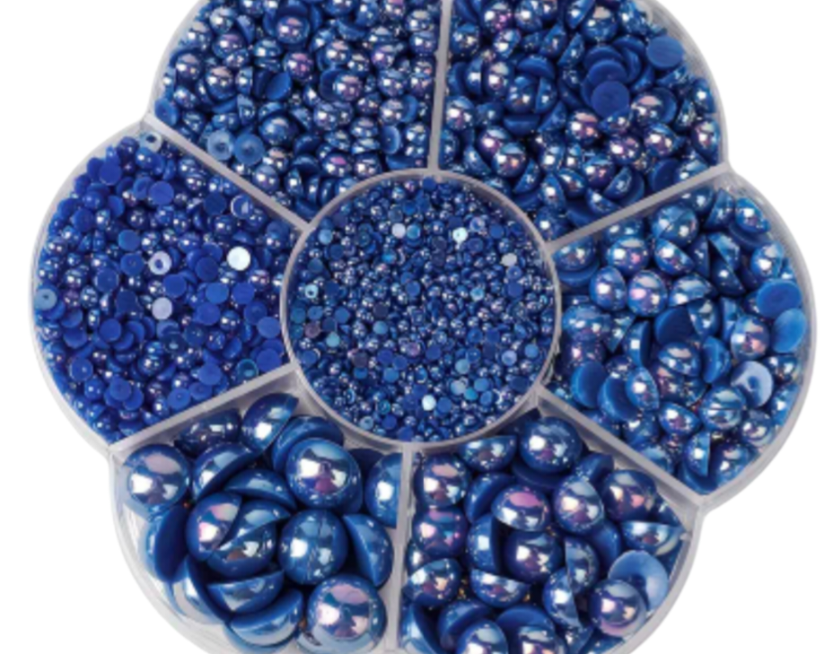Round container with blue and purple pearls for nail art and crafts.