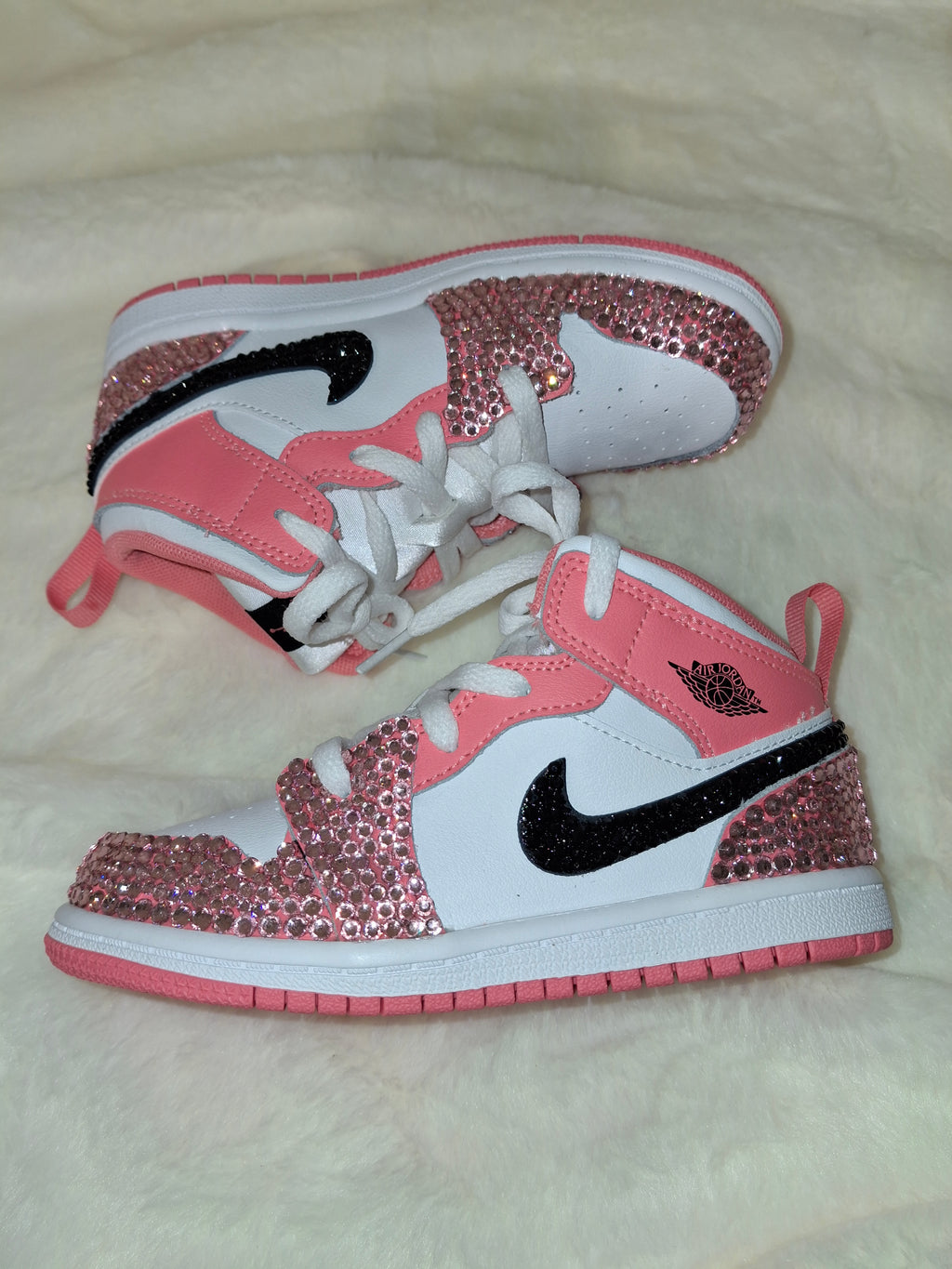 Custom pink and white Air Jordan Mid 1 kid's sneakers by Dressed and Done