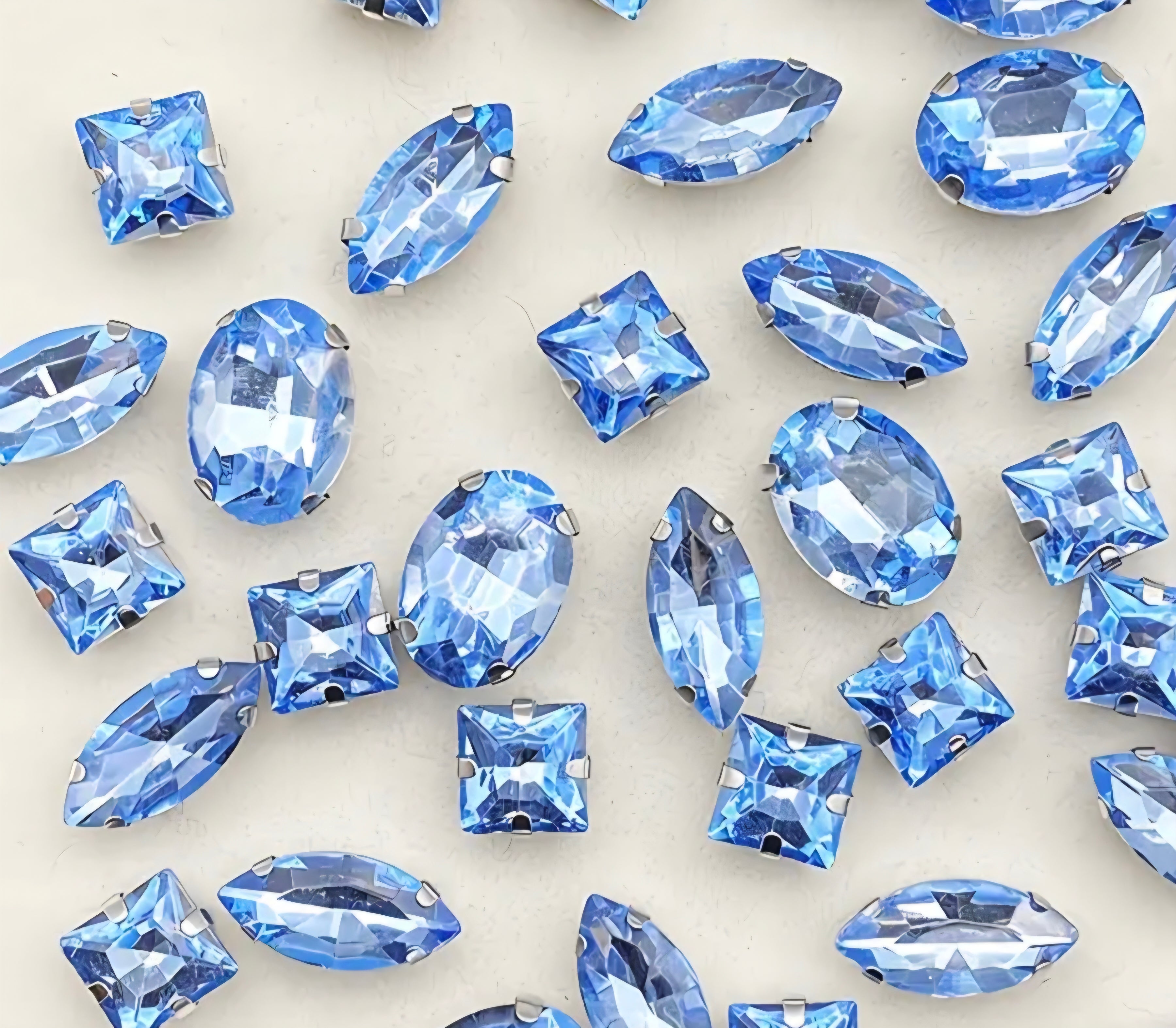 Collection of blue gemstones on a light background