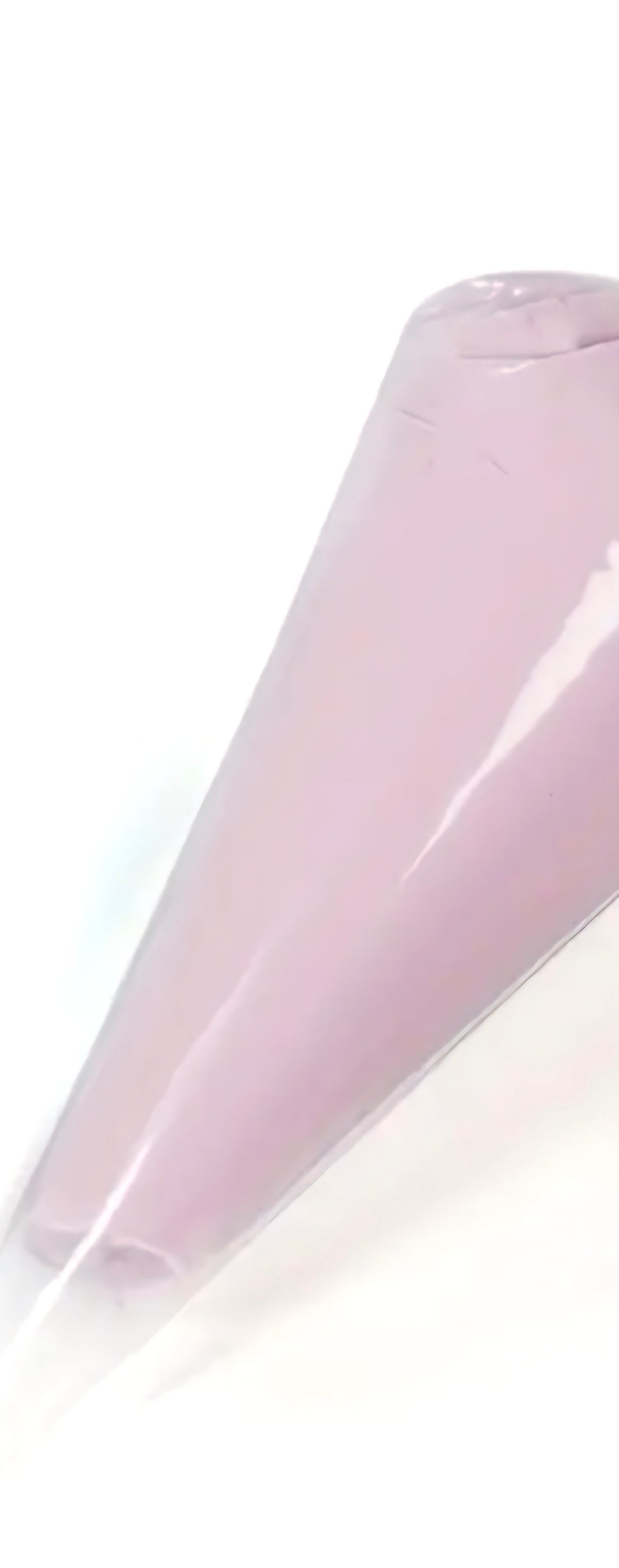 Pink decoden cream glue tube on a white background.
