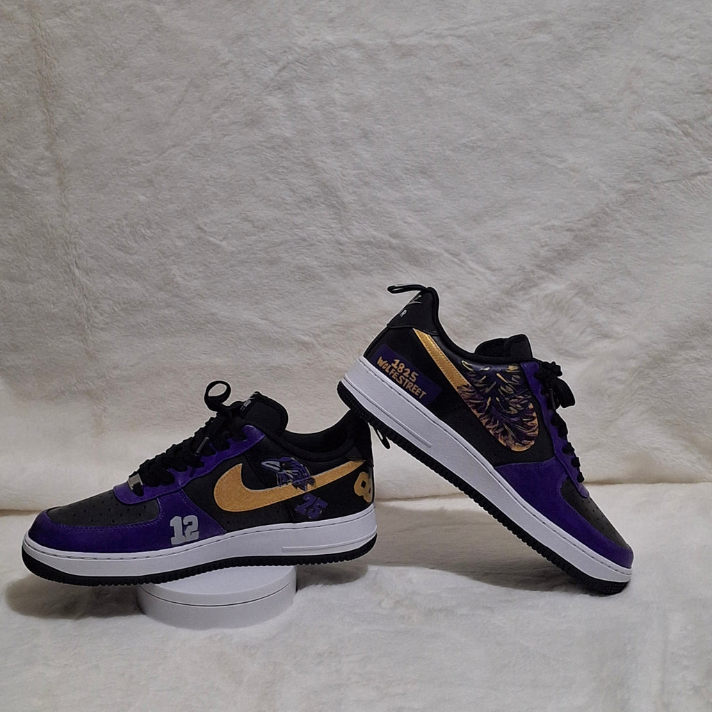 Custom hand painted Nike Air Force 1 sneakers featuring purple, black and gold sports inspired art work. 