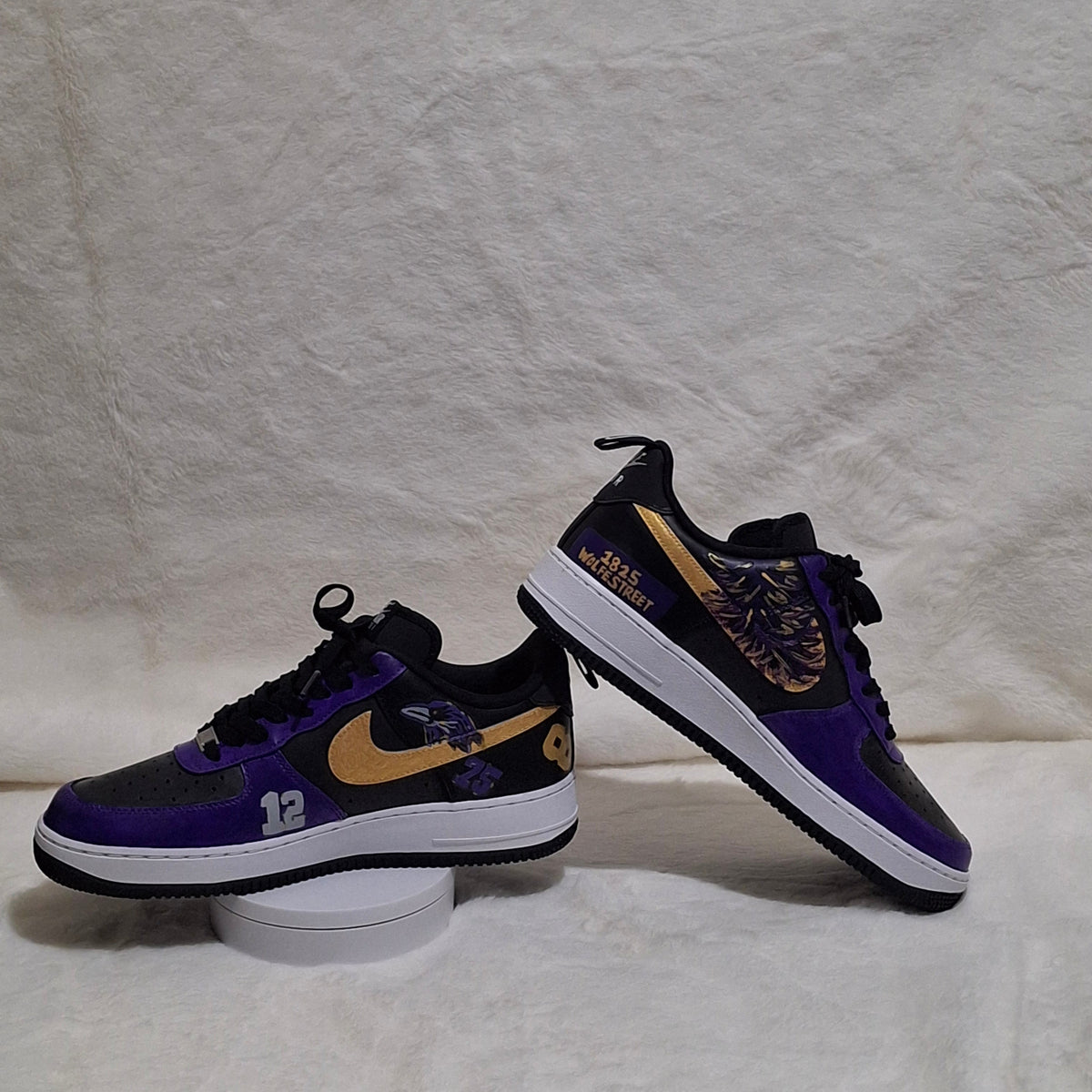 Custom hand painted Nike Air Force 1 sneakers featuring purple, black and gold sports inspired art work. 