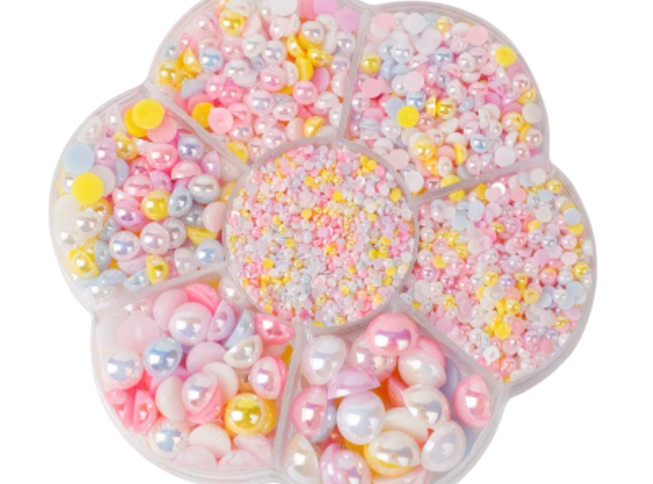 Colorful pearls for diy on a white background