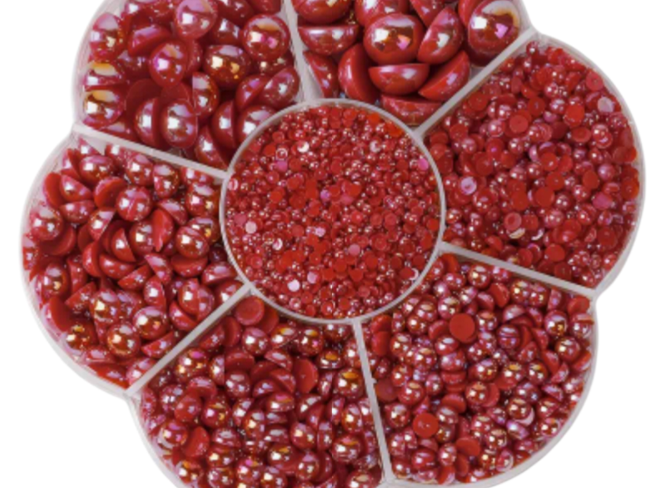 Red Pearls for diy crafts and nails on a white background