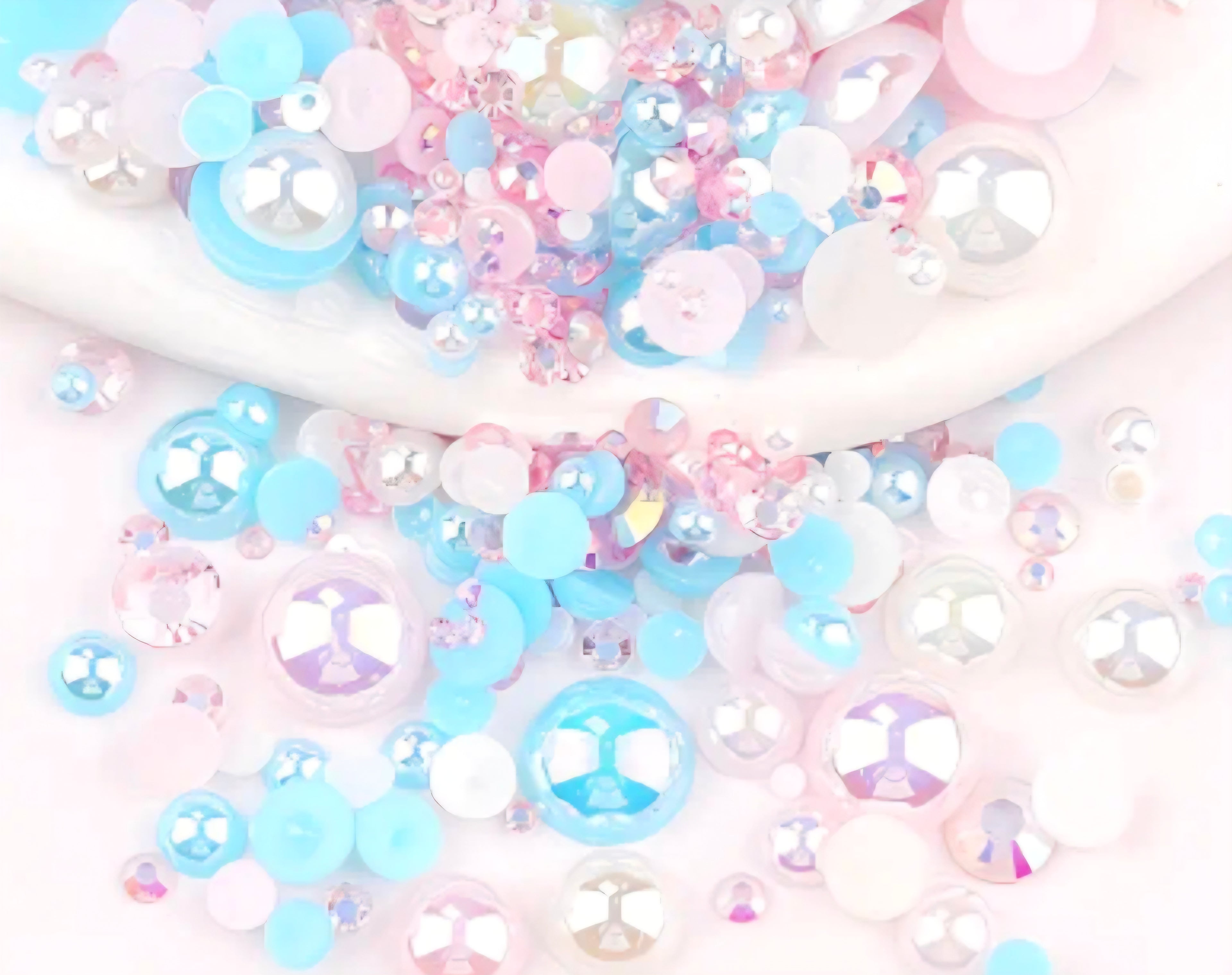 Pastel-colored embellishments with a focus on blue, pink, and white.