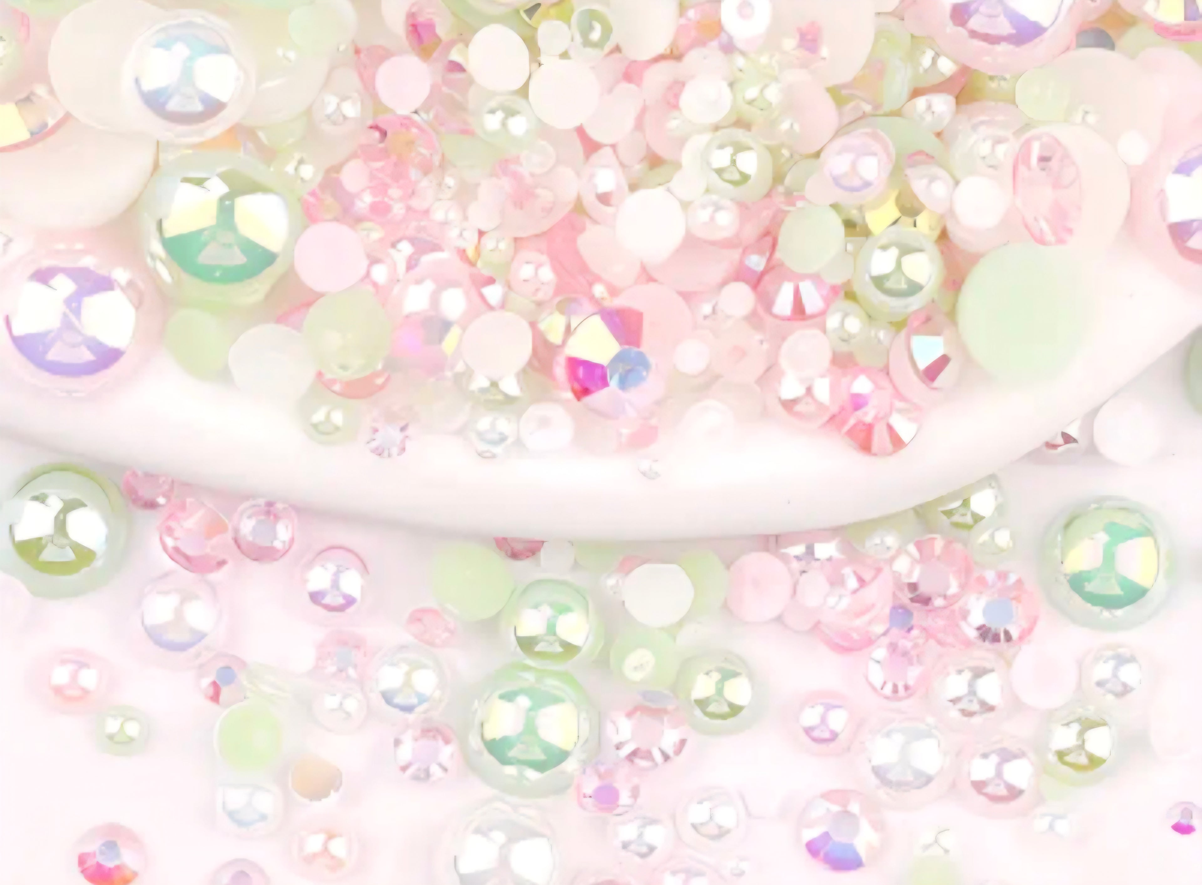 Pastel-colored rhinestones on a white background