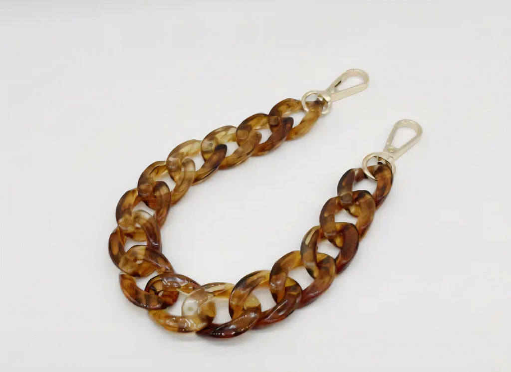 Brown chain strap on a white background