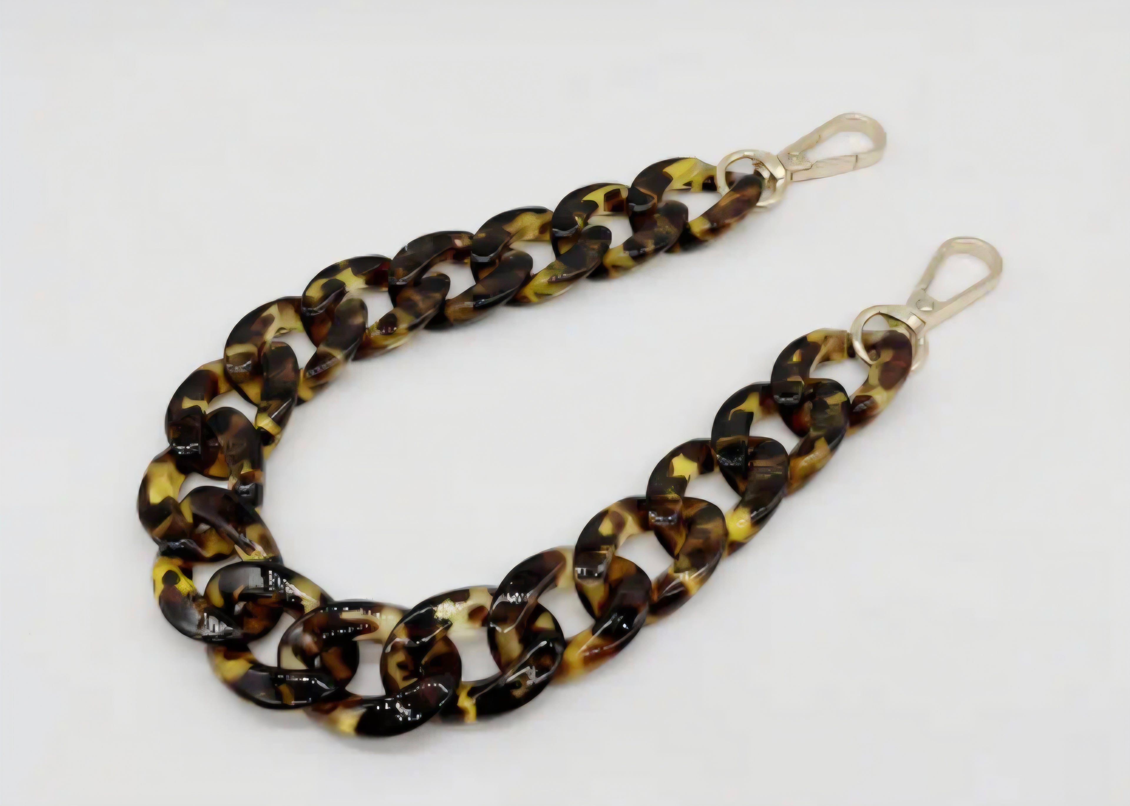  Tortoiseshell chain strap on a white background