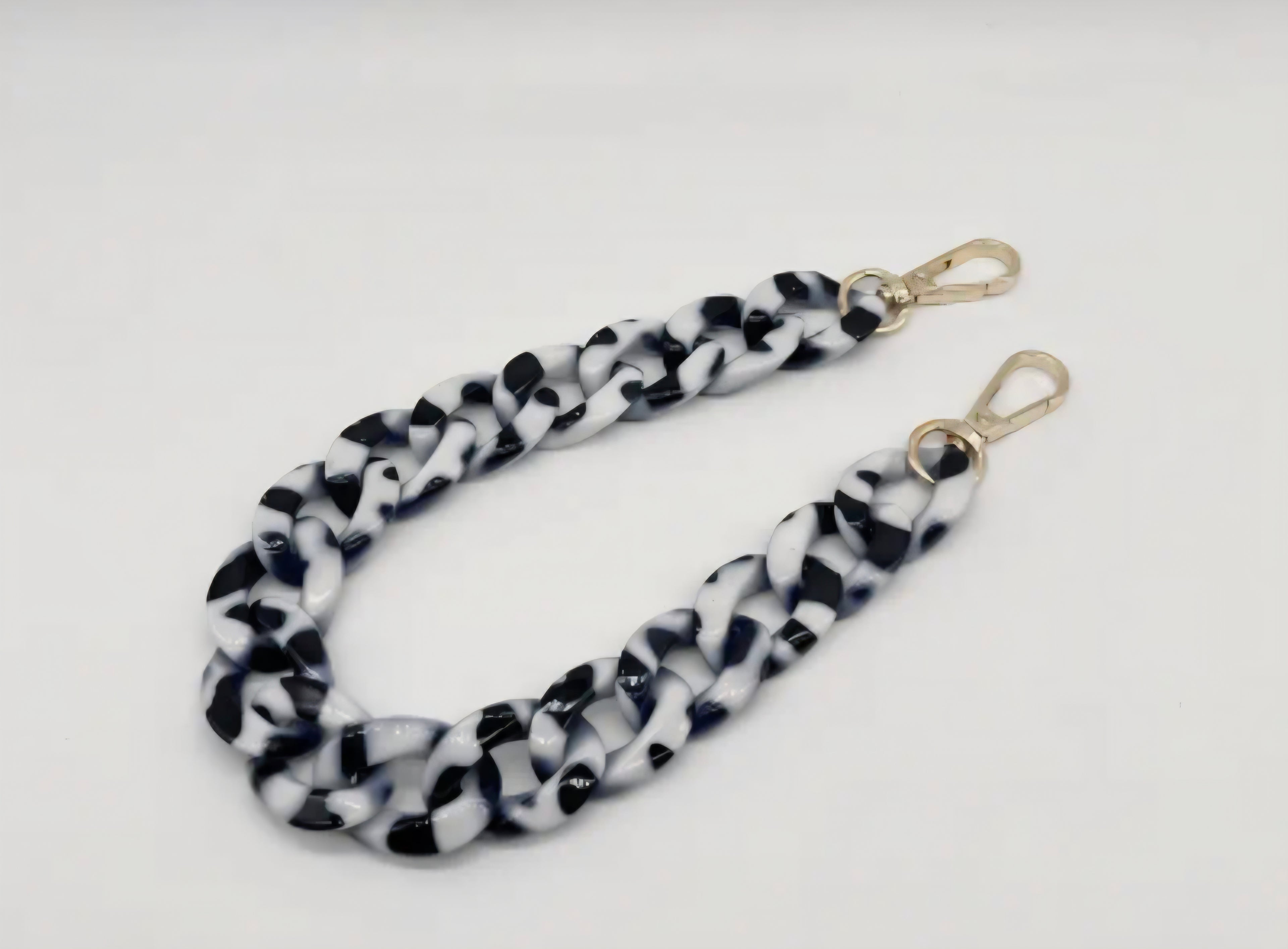 Black and white purse chain on a white background