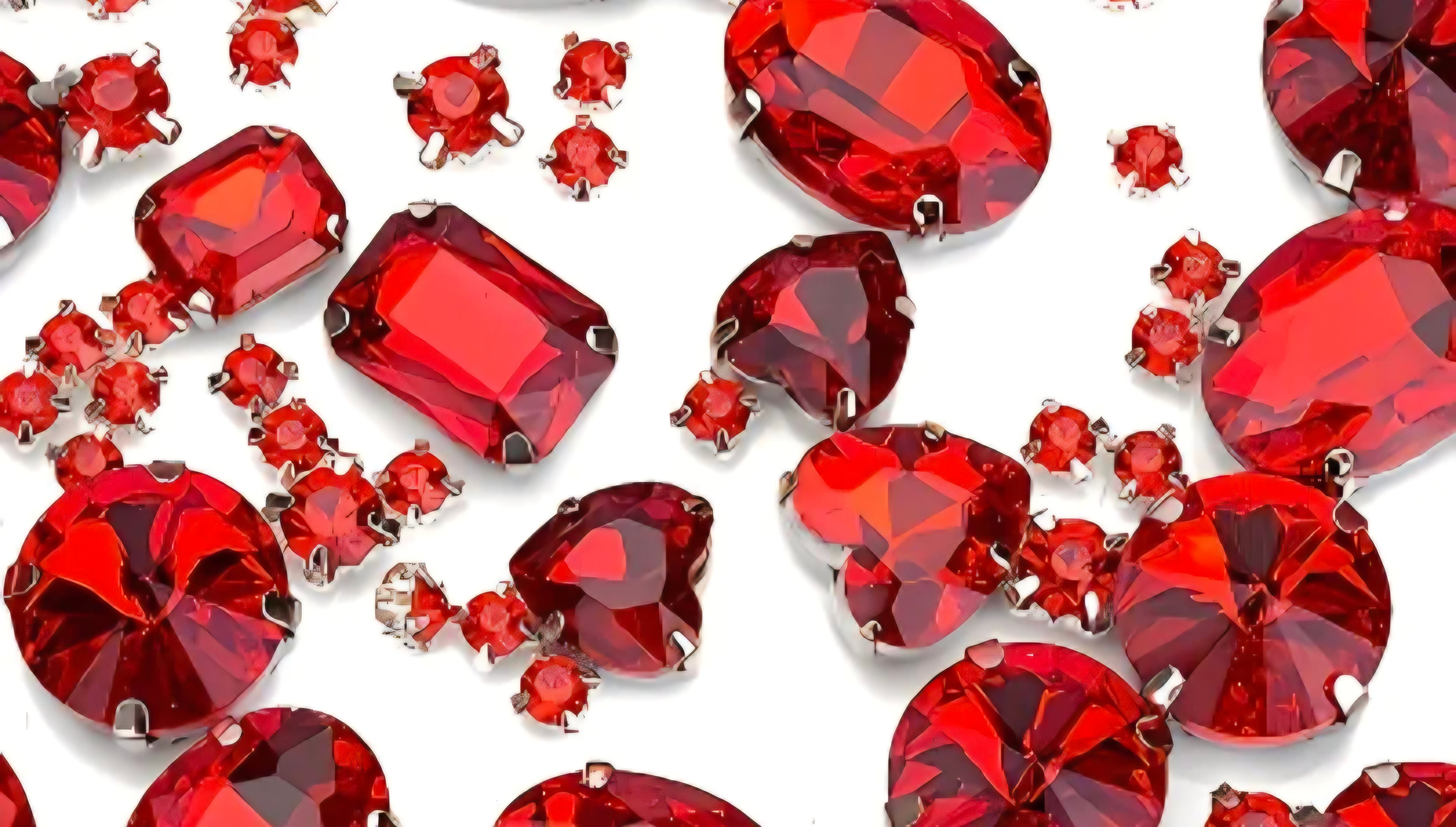 Red gemstones on a white background. 
