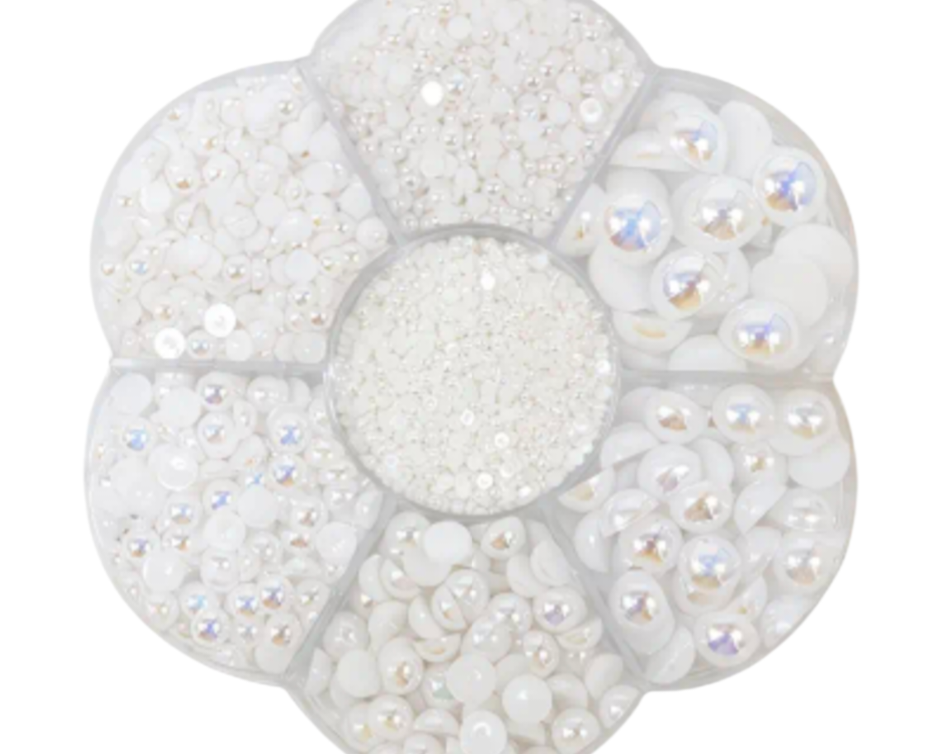 White colored various size pearls on a white background